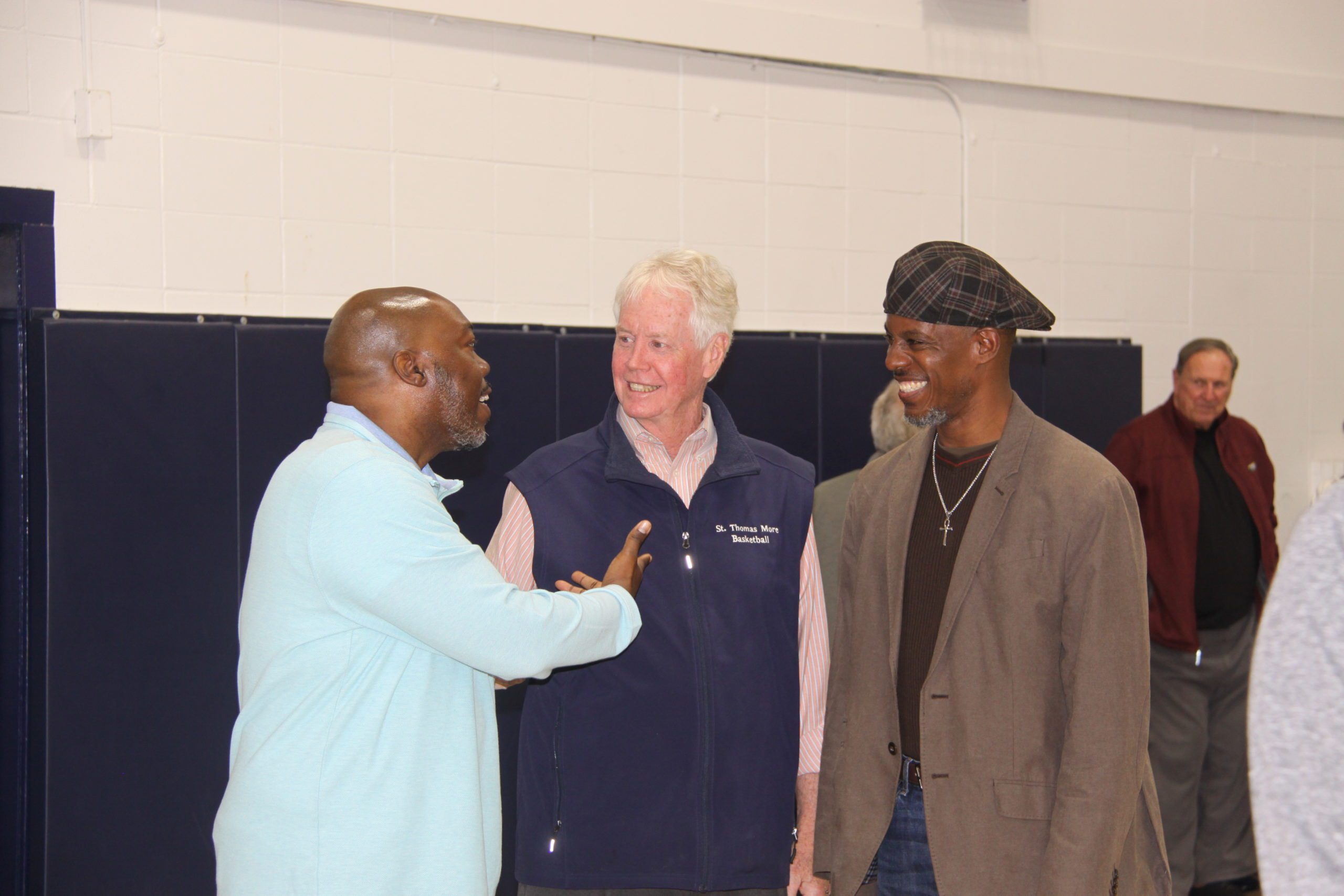 STM Head Coach Jere Quinn with STM Alumni Basketball Stars