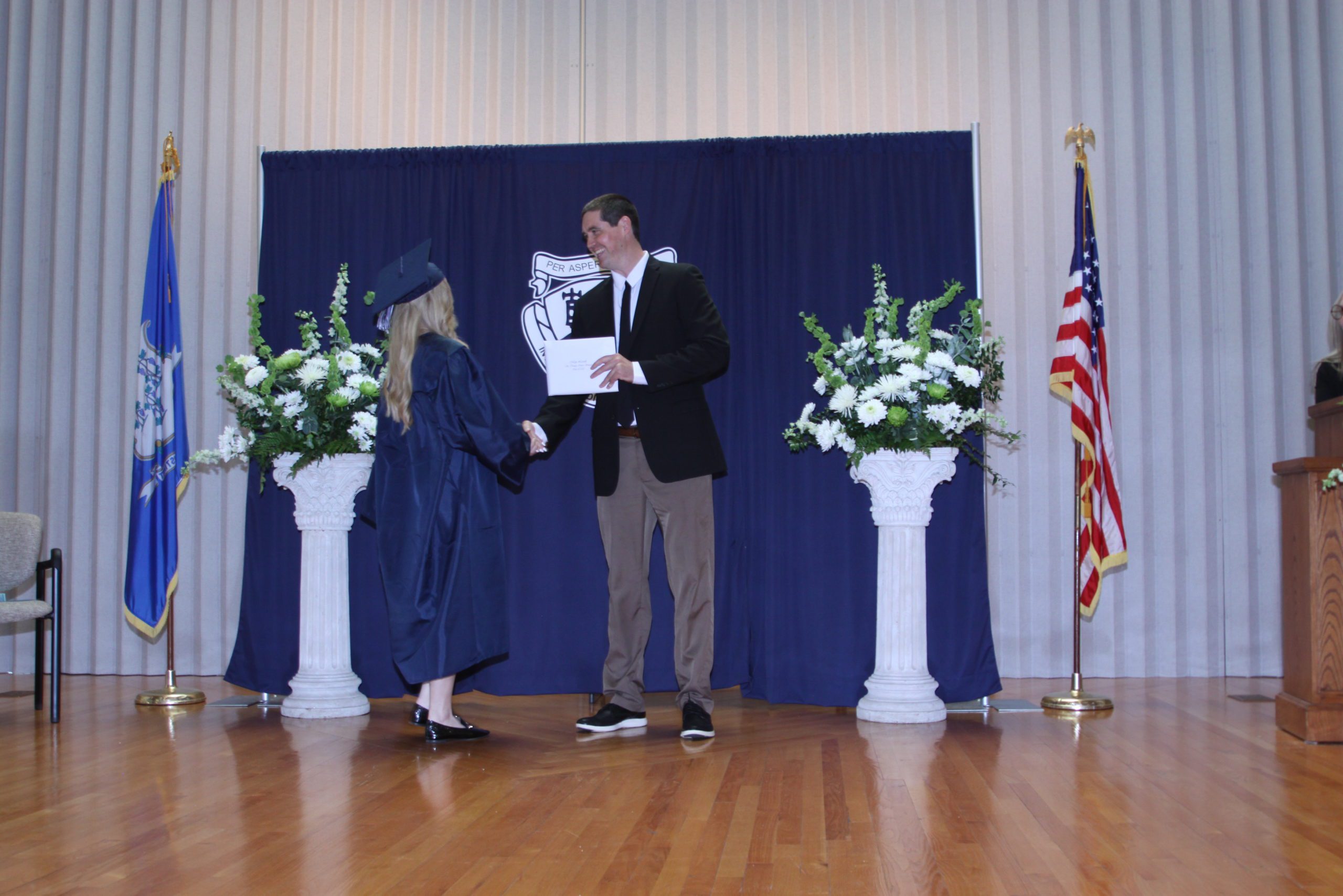 STM Female Student Accepts Diploma