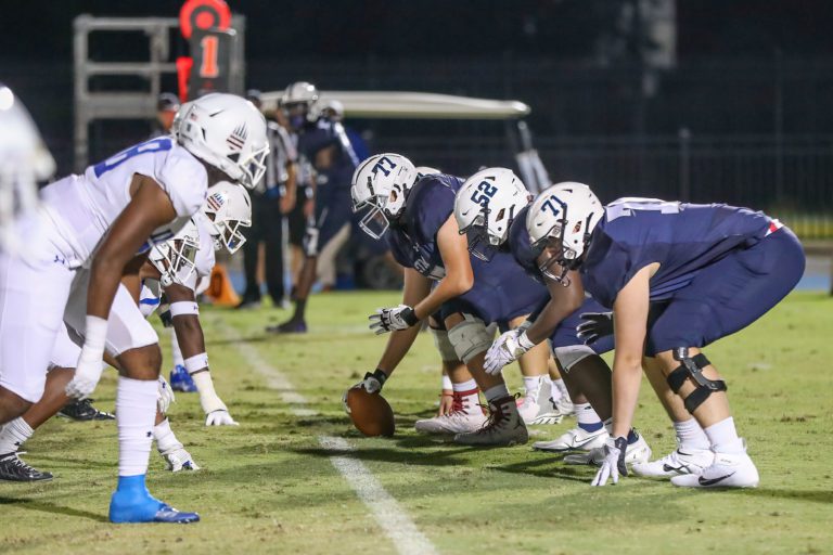 STM football team about to make a play